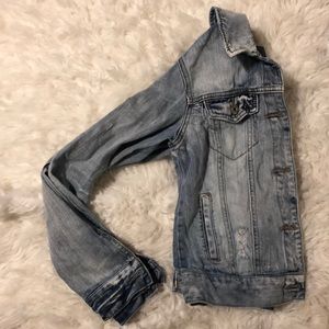 Distressed light wash denim jacket